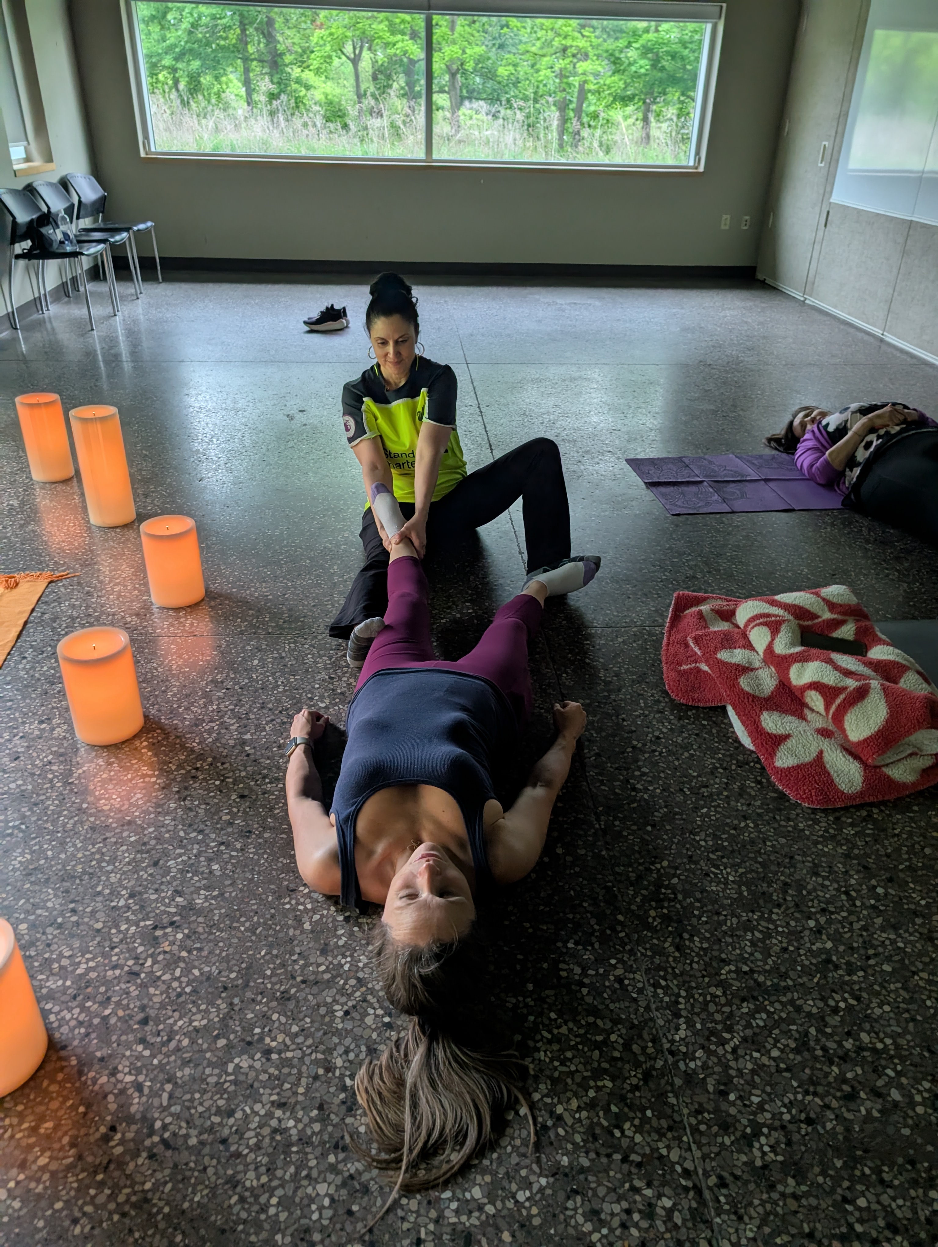 Joanna guiding a client through a fascial maneuver, releasing what's been held in the body